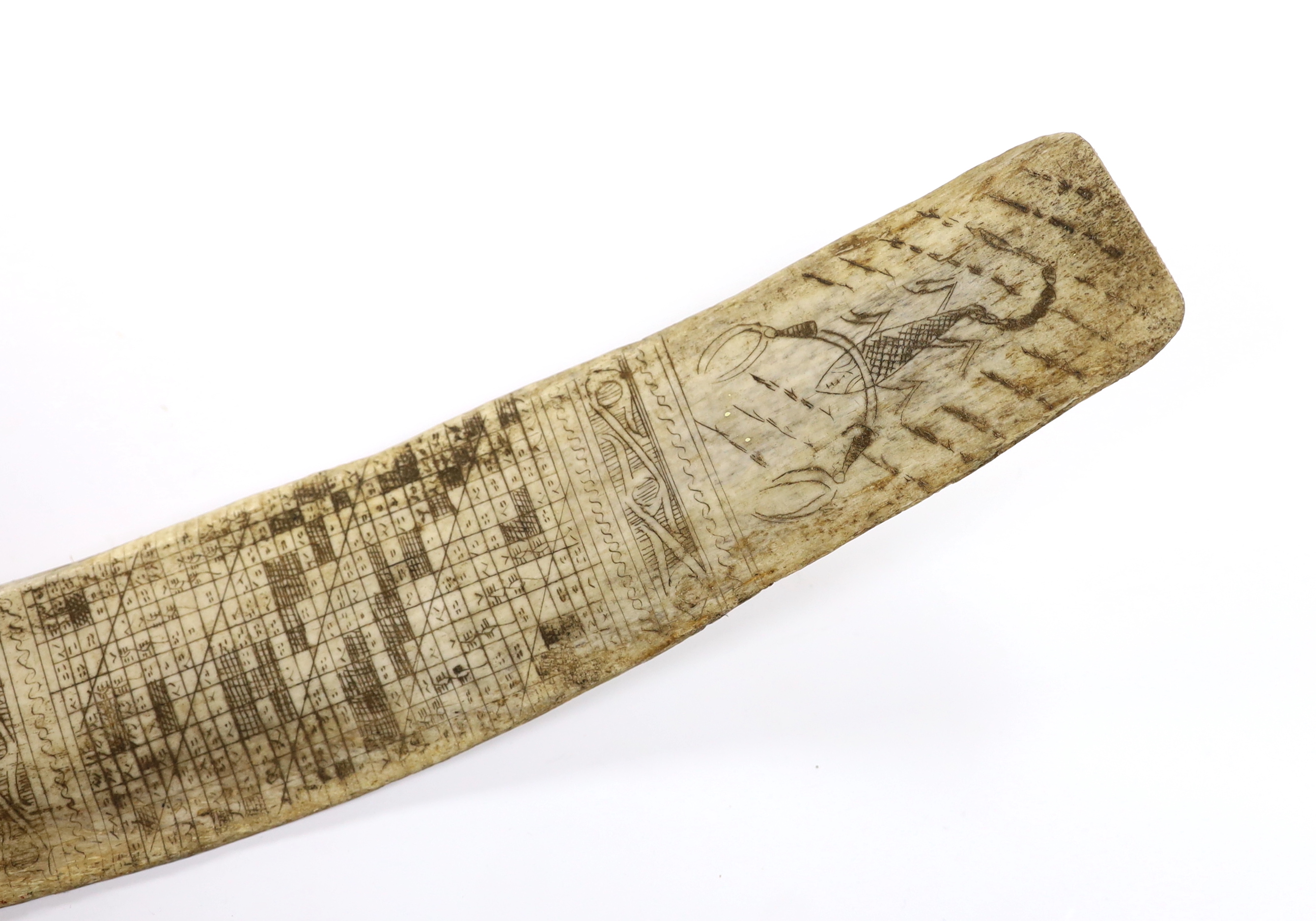 A late 19th/early 20th century Indonesian, Sumatran, carved buffalo rib calendar, Batak, 37cm